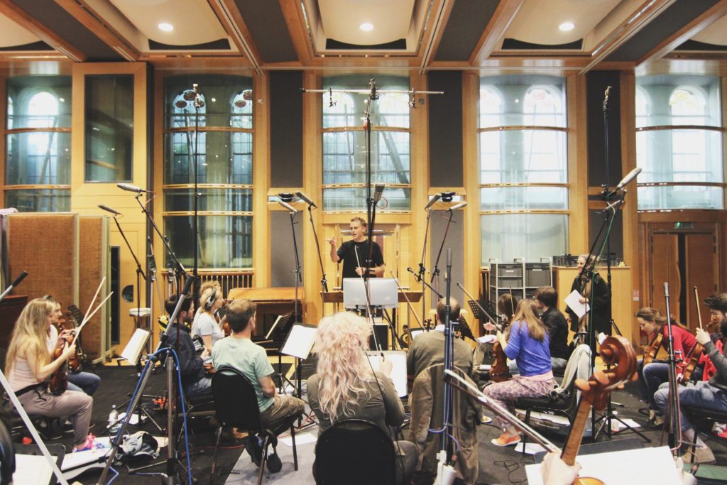 Sheridan Tongue briefing string players before a recording session at Air Studios London